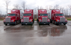 4 Red Semi-Trucks in a Row